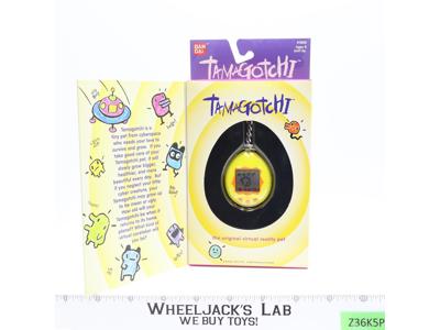 #1800 Yellow & Orange Tamagotchi 1997 Bandai Virtual Reality Pet NEW SEALED