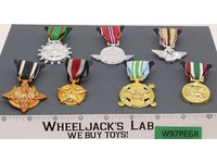 Lot of 7 Military Muscle Men Medals Toymakers 1980's Action Figure